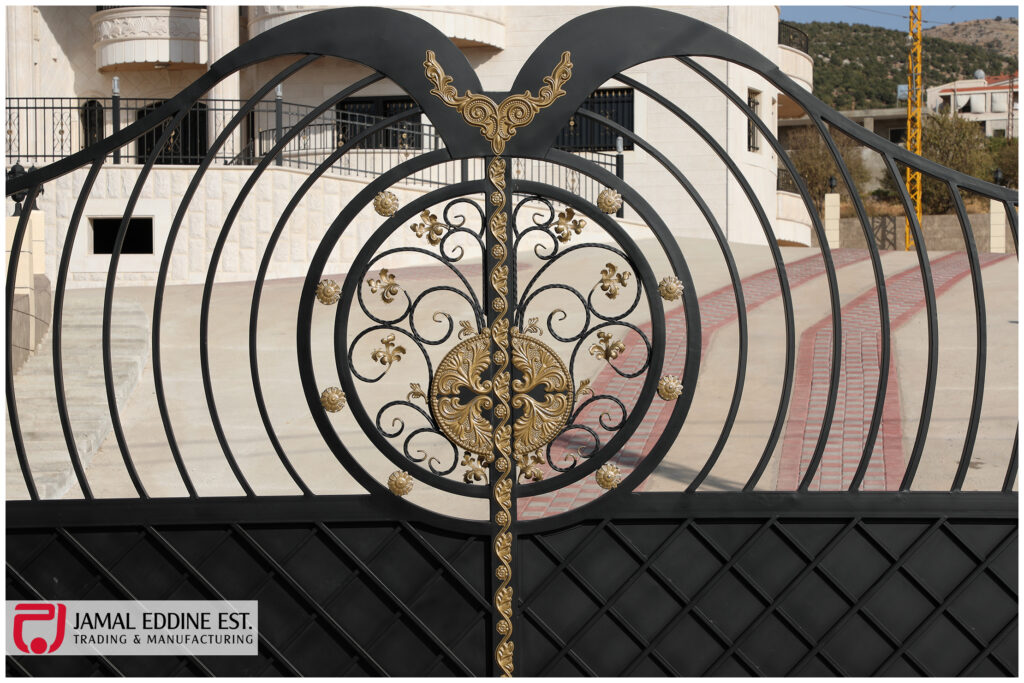 wrought steel gate with decorative laser cut designs in black and gold