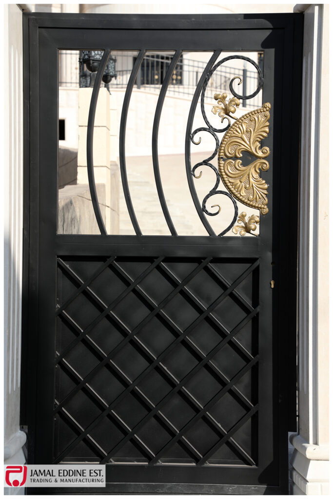 wrought steel door with decorative designs and open window and railings