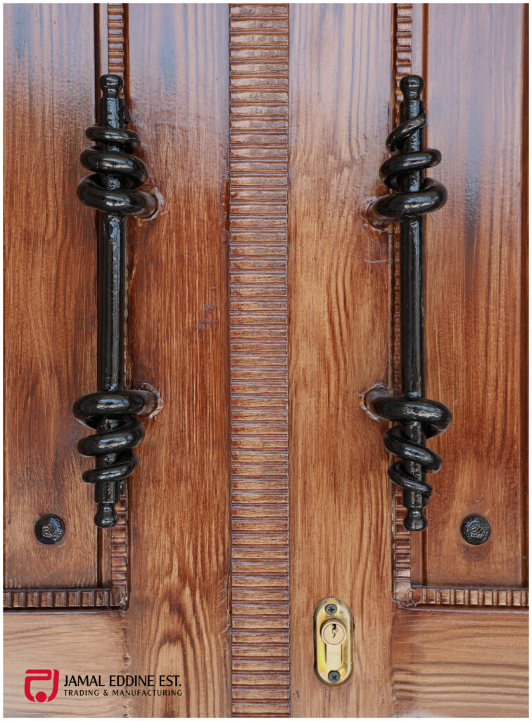 door design with wrought steel ferfoje railings and handle