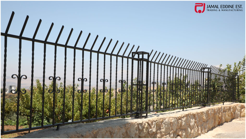 wrought steel high fence rails installed in a home's garden