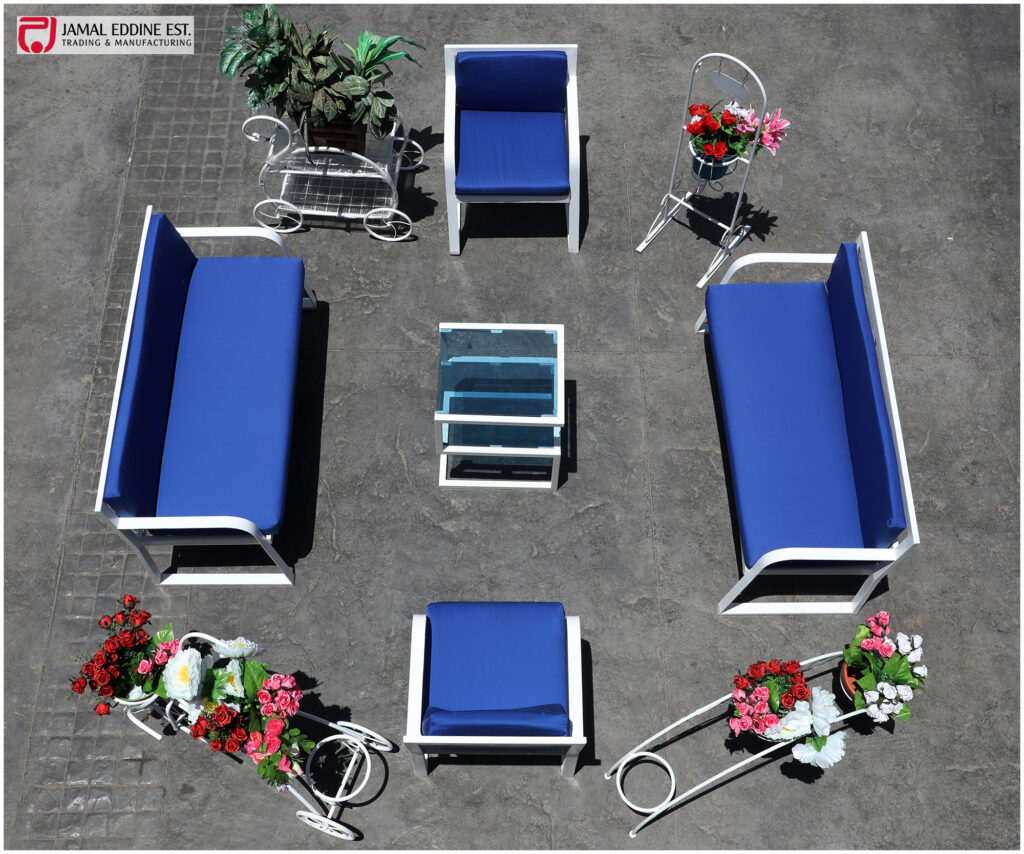 wrought steel patio set 4 piece furniture in white and blue. One three seater, one two seater, and two single chairs with a table and decorative steel table