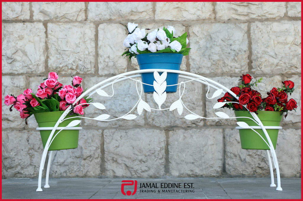 wrought steel decorative outdoor flower pot or plant holder in white with laser cut vine and leaves design