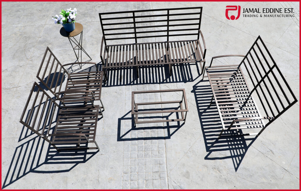 wrought steel patio set 4 piece furniture in brown. One three seater, one two seater, and two single chairs with a table and decorative steel table