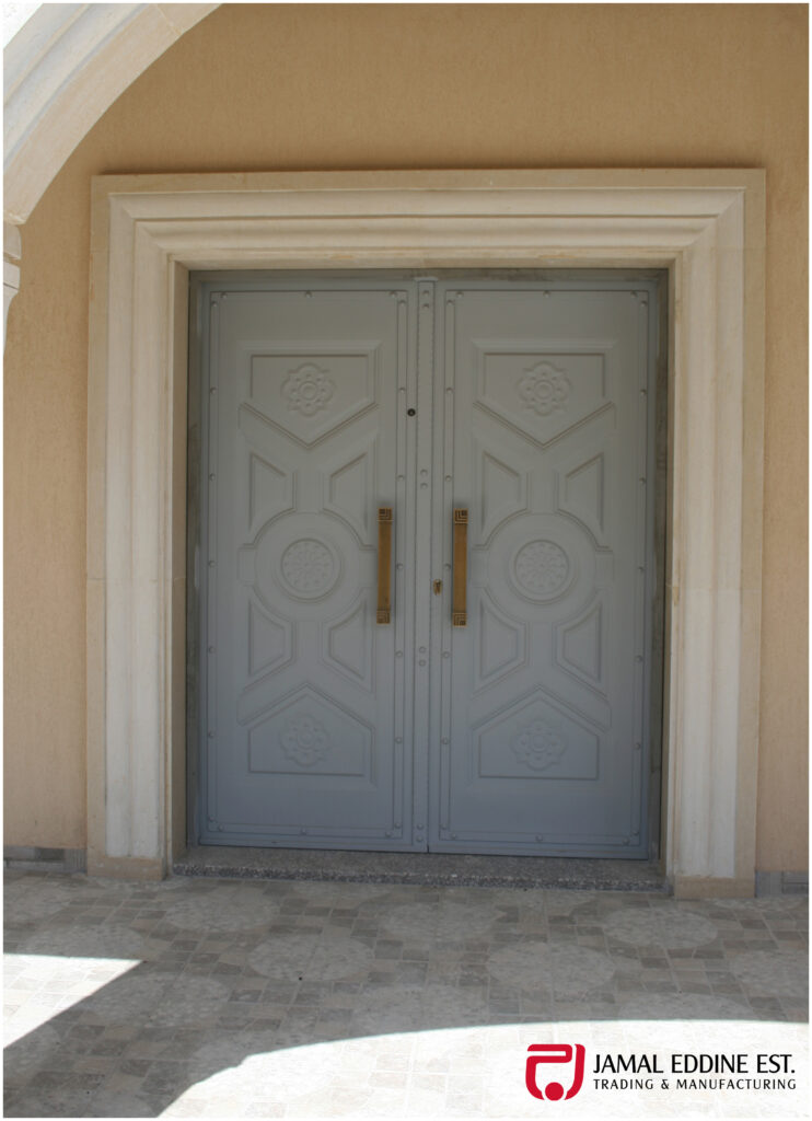 wrought steel door closed off with decorative designs