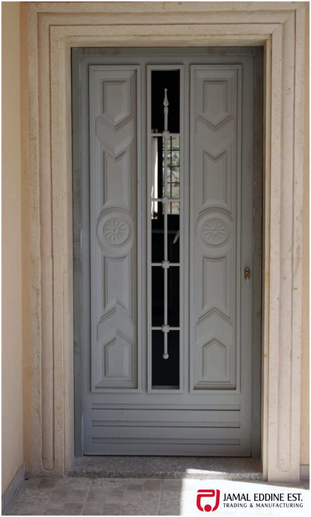 wrought steel door with decorative designs and open window